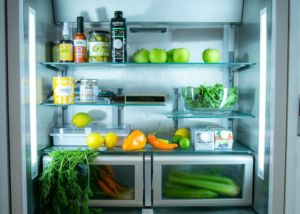 Fridge with organic fruit and vegetables